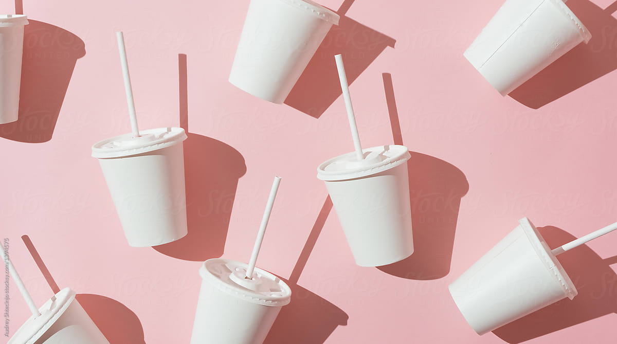 white milkshake disposable cups on pink