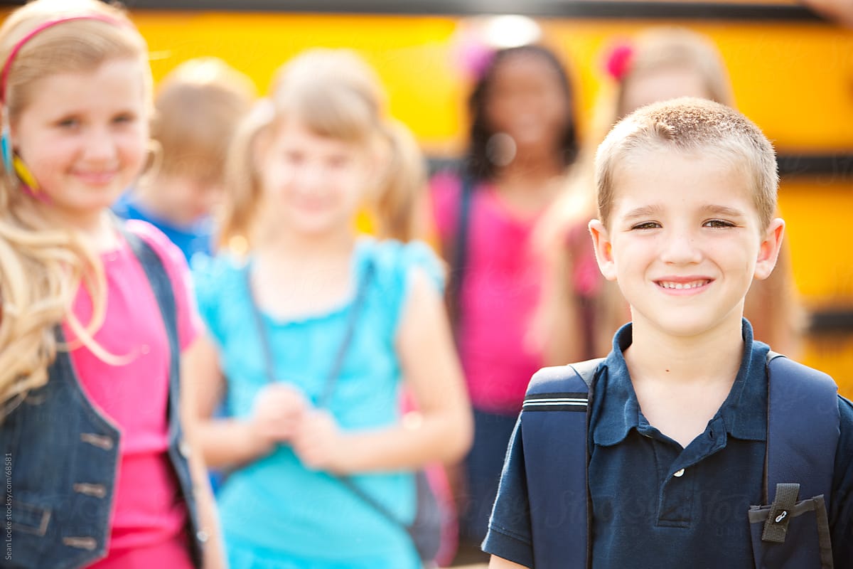 School Bus: Focus on Cheerful Smiling Kid