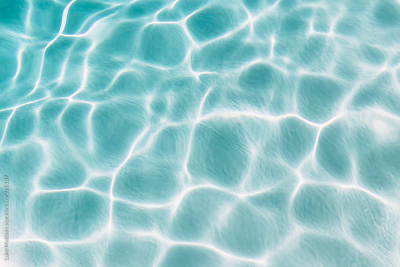 Ripples And Light Pattern On Water Of Aqua Blue Pool