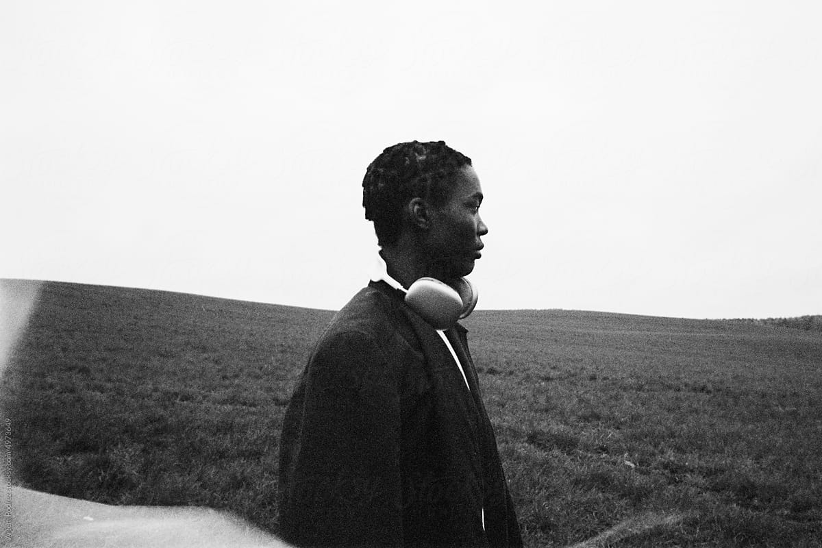 Film photo of a black man listening to music