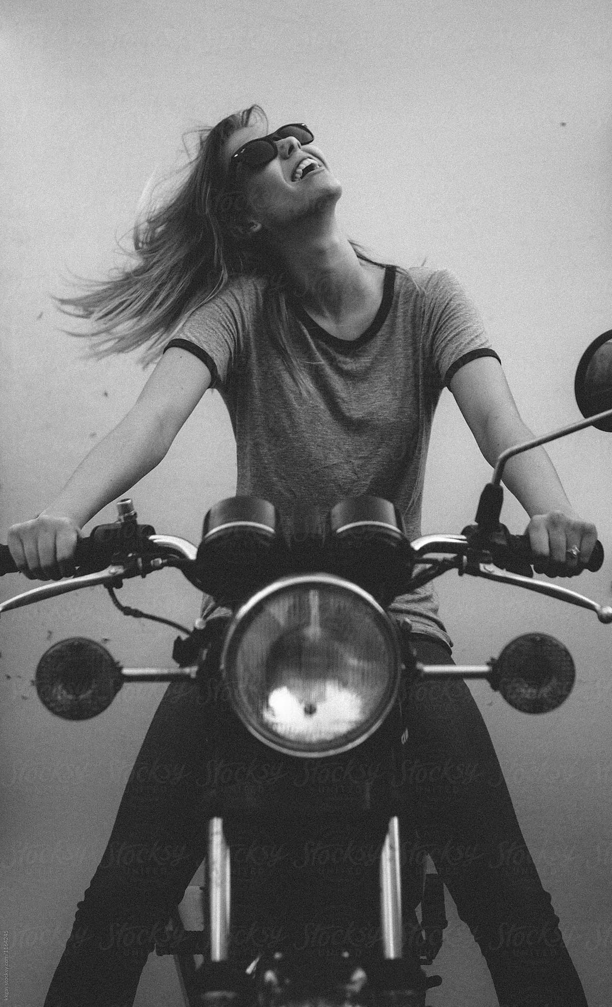 Carefree woman on a motorbike