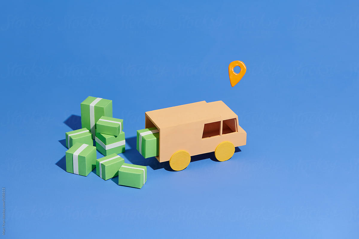stylized van for delivery with cardboard boxes and location symbol