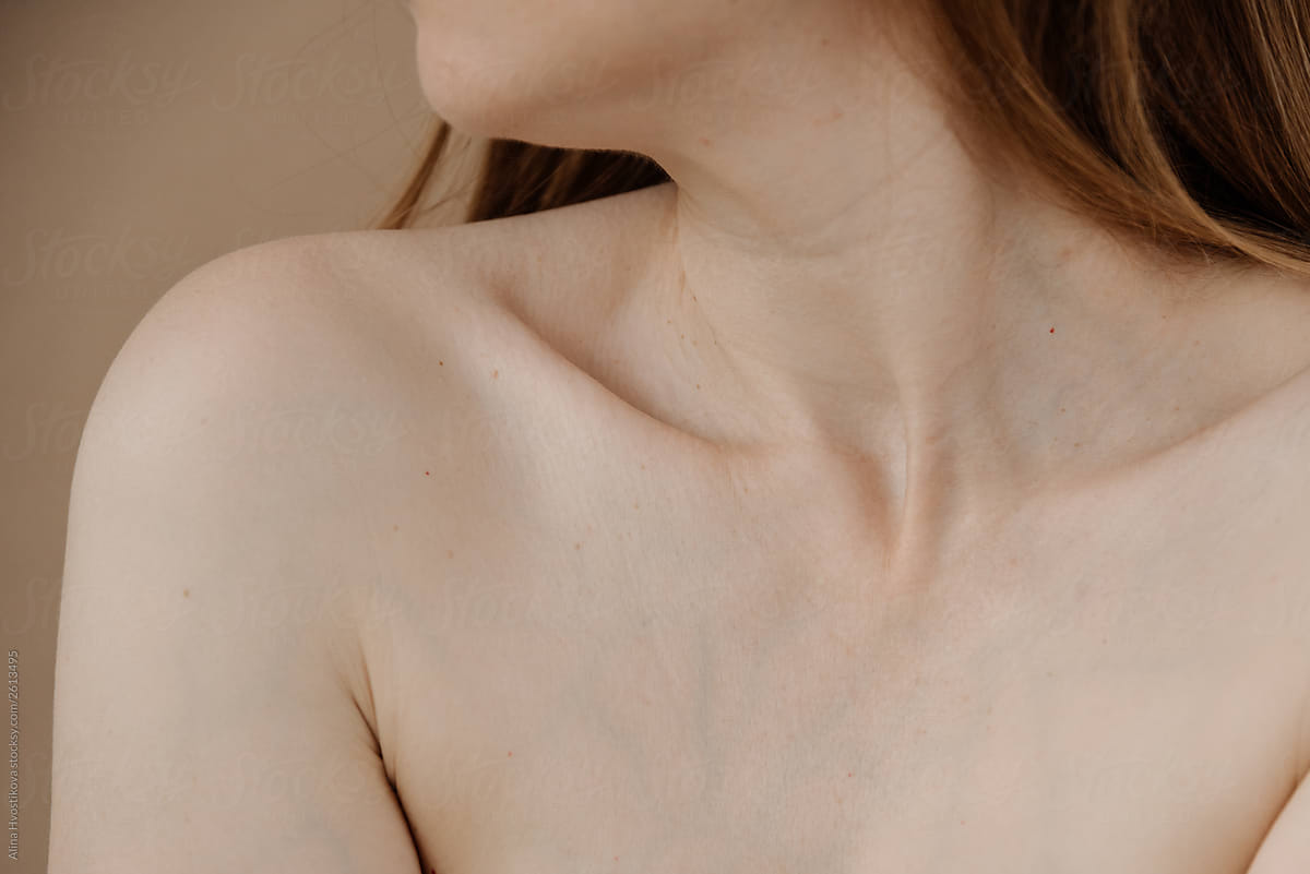Close up of bare skin of neck and shoulders.