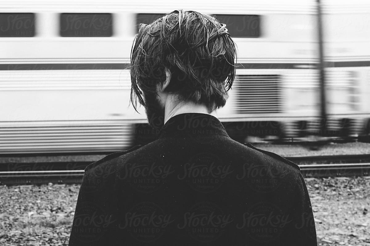Back of Bearded Man\'s Head by Moving Train in Black and White