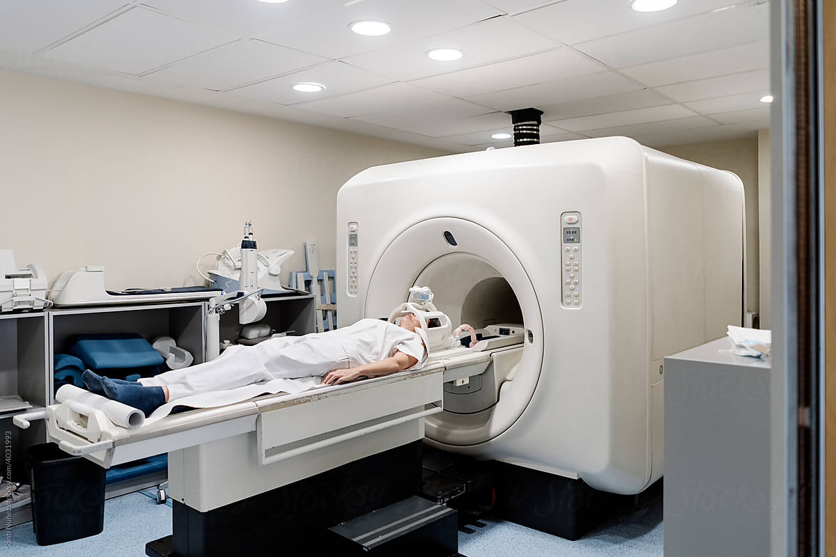 Unrecognizable patient inside X-Ray Machine