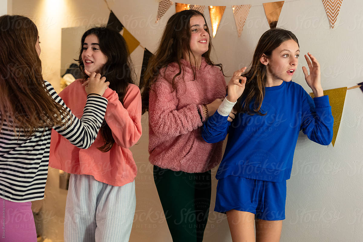 spontaneous moment of young girls in a pyjama party