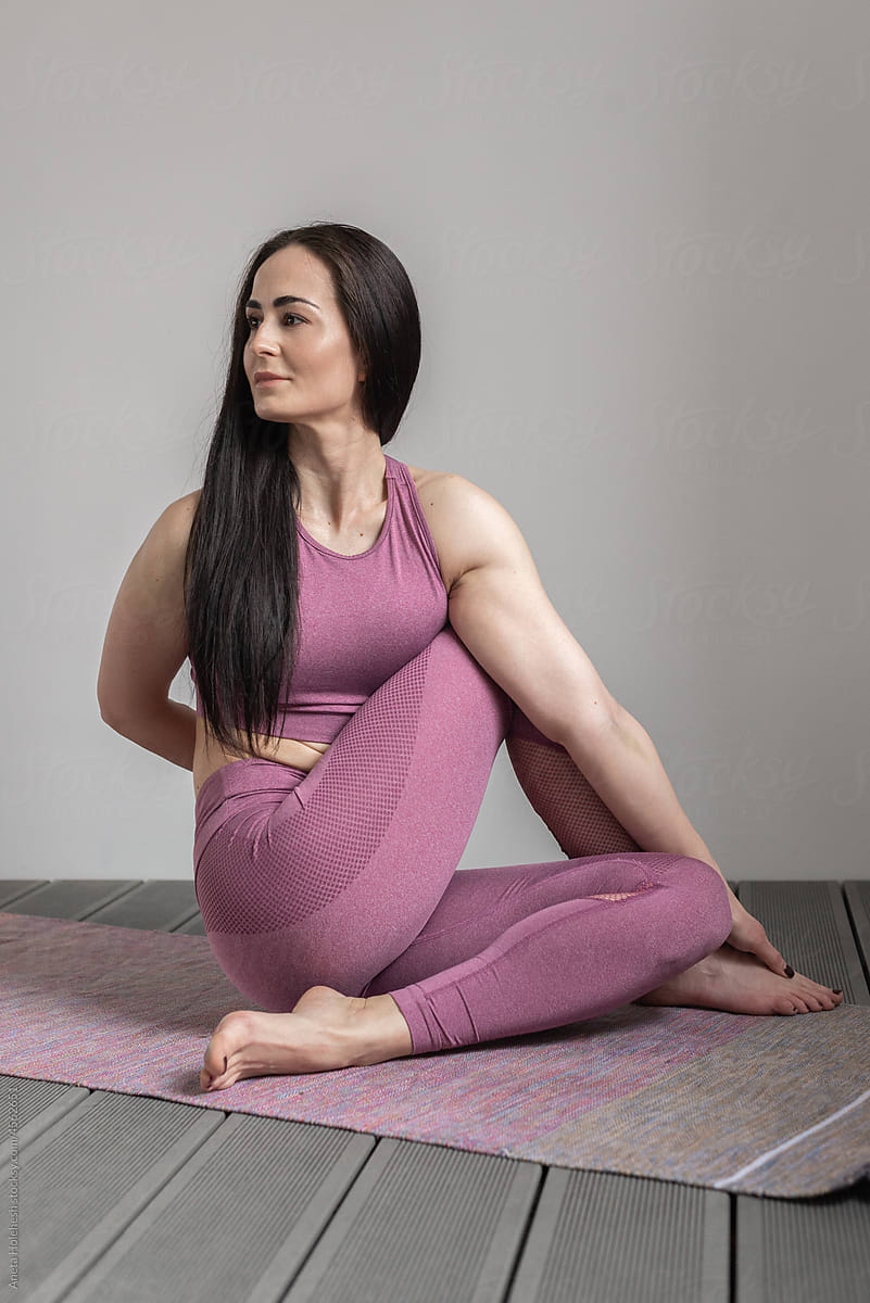 Woman in Seated Spinal Twist Yoga Pose