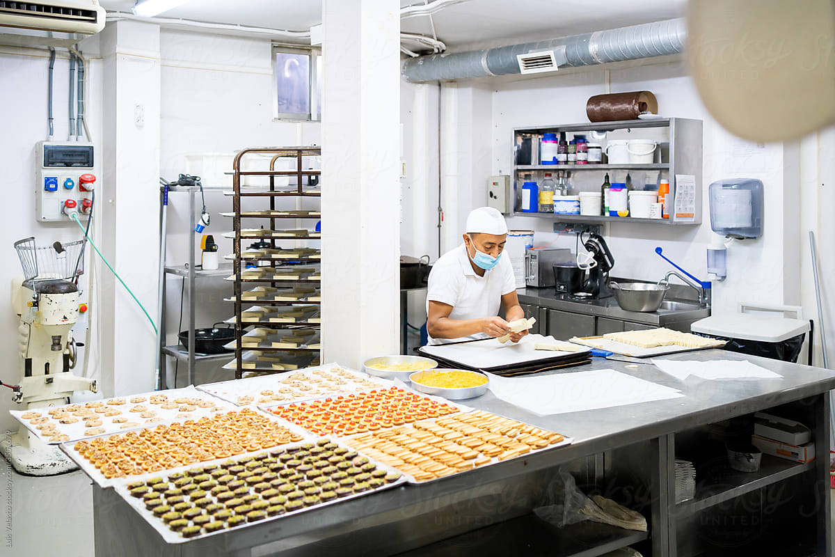 Man Worker In The Cookie\'s Factory.