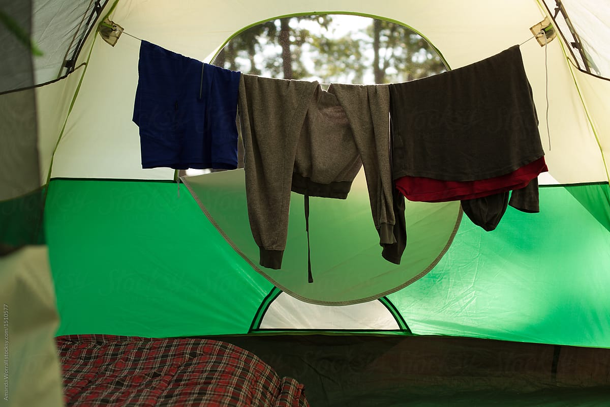 Clothes hanging to dry inside of a tent