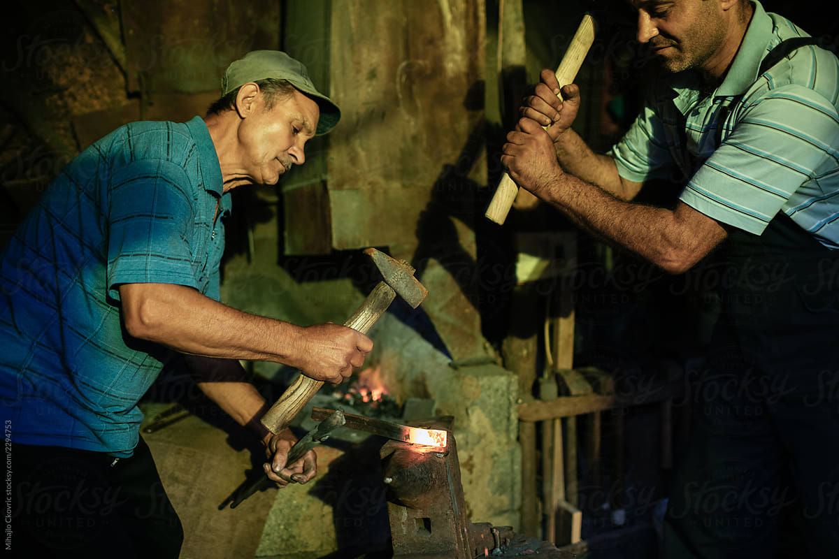 Blacksmiths working in a workshop