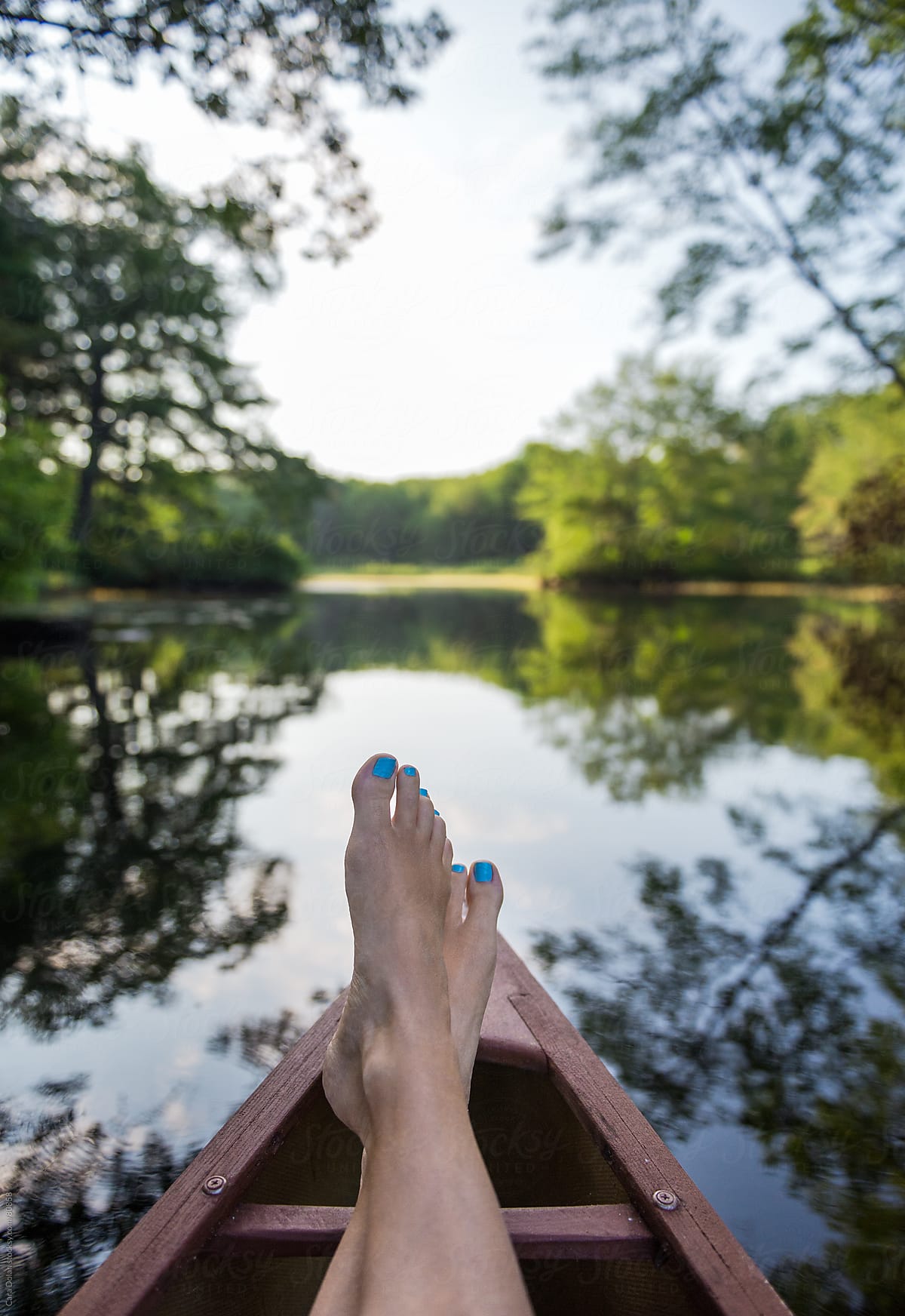 POV Foot Selfie of Feet in Canoe on River