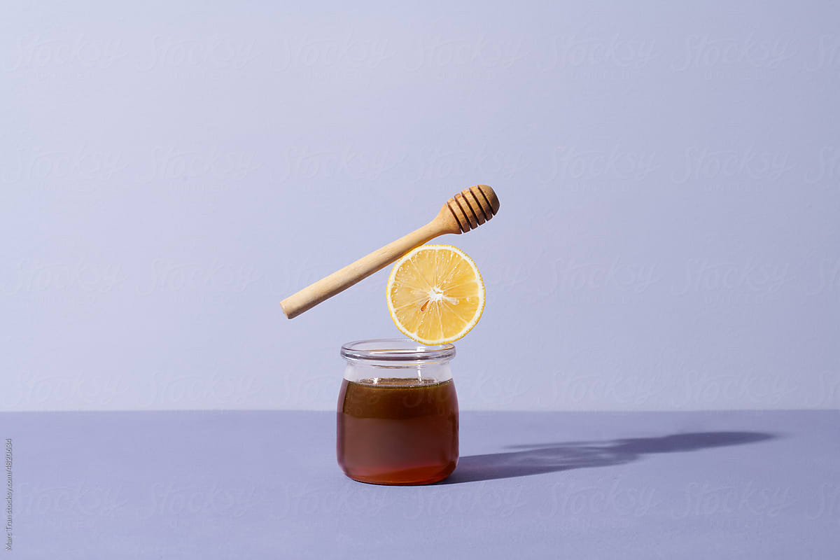 Creative still life of healthy black tea with honey and lemon