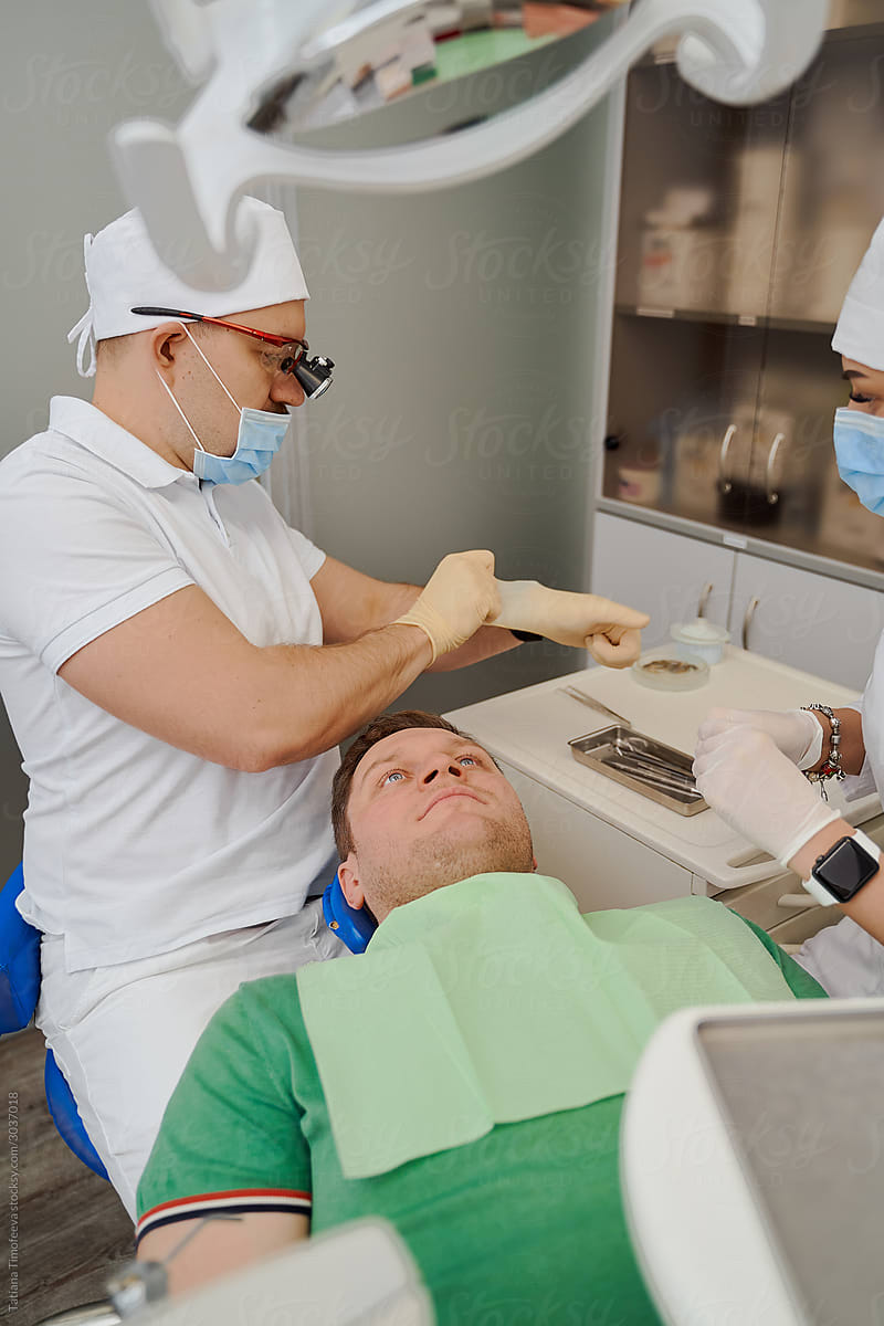 the dentist is preparing to receive a patient