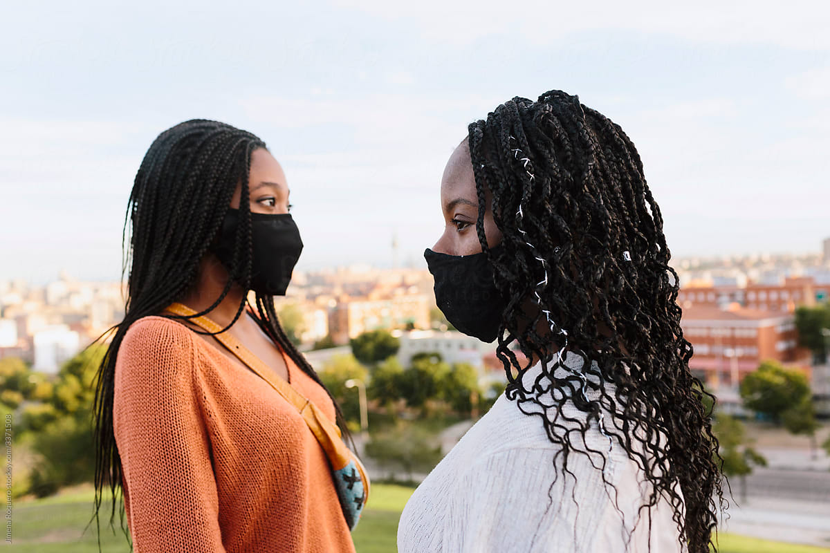 Black women with face mask outdoors