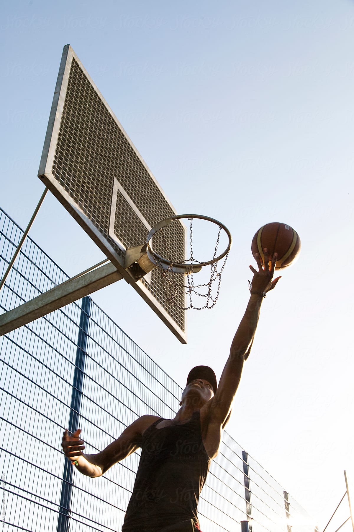 From below view of man playing basketball