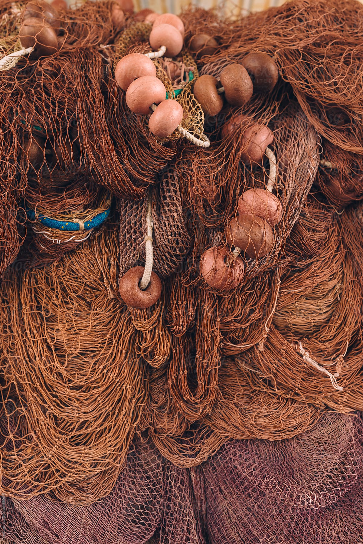 Colorful Fish Nets Hanging In A Big Pile In Italian Fishing Village by  Stocksy Contributor Trent Lanz - Stocksy