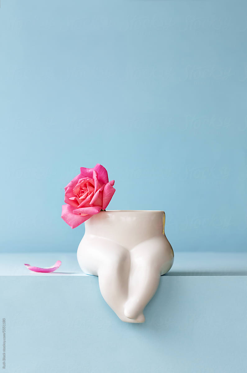 Torso vase with pink rose