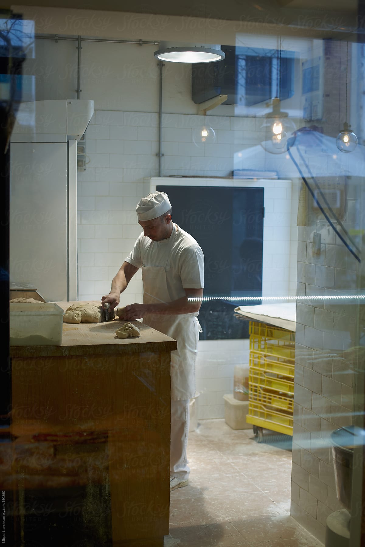Baker At Work In The Bakery Workshop By Stocksy Contributor Miquel