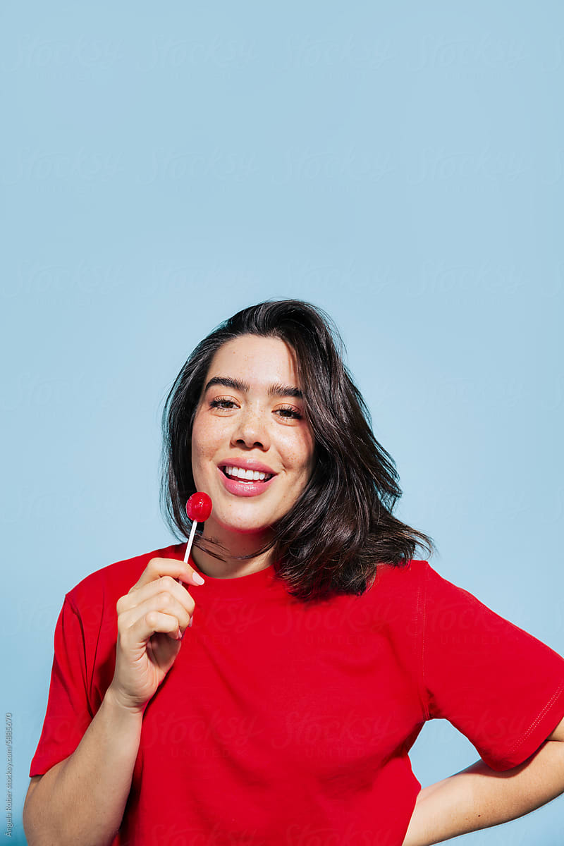 Woman with Lollipop and a Bright Smile