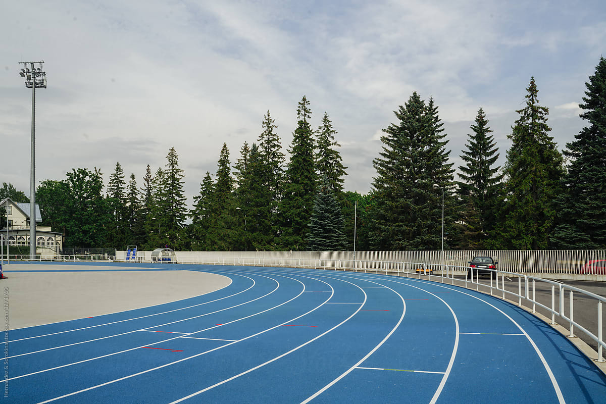 Blue Running Lanes At Modern Open Air Stadium