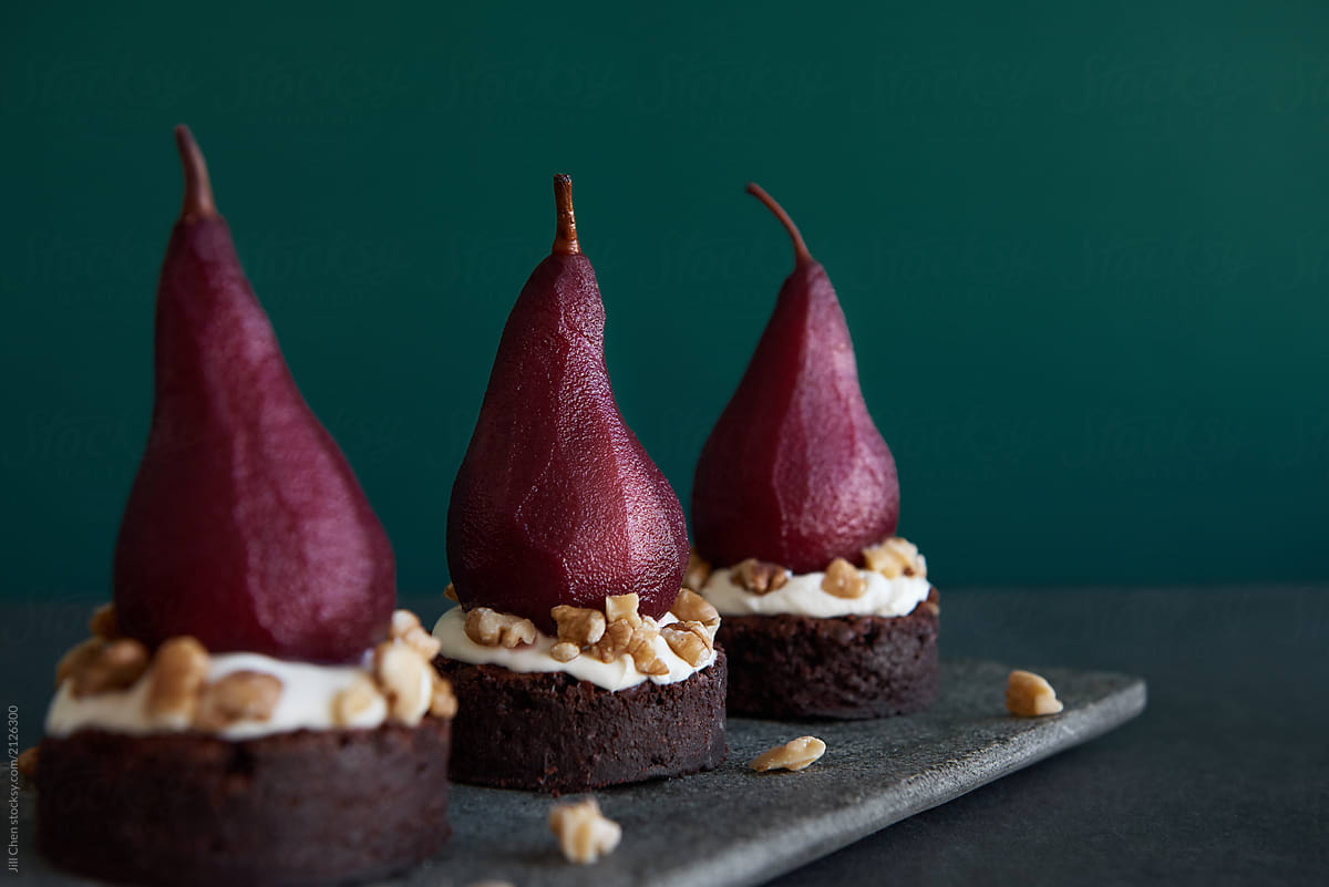 Fruit dessert red wine poached pears with cake