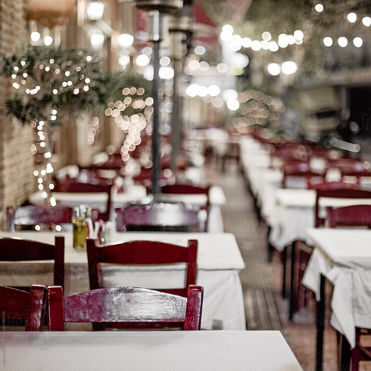 An Outdoor Restaurant Decorated with Christmas Lights in Greece