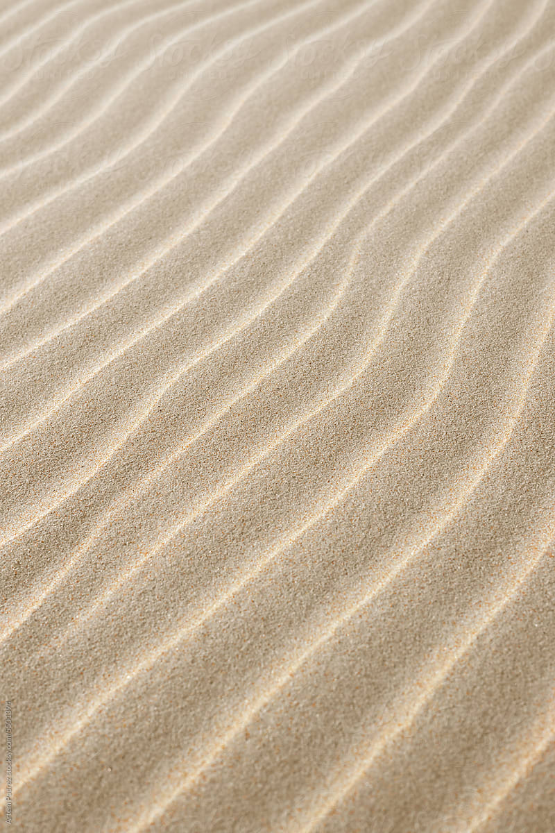 Calm sandy beach with small waves