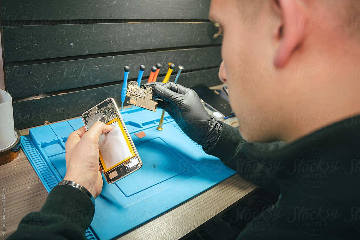 Man repairing a smartphone