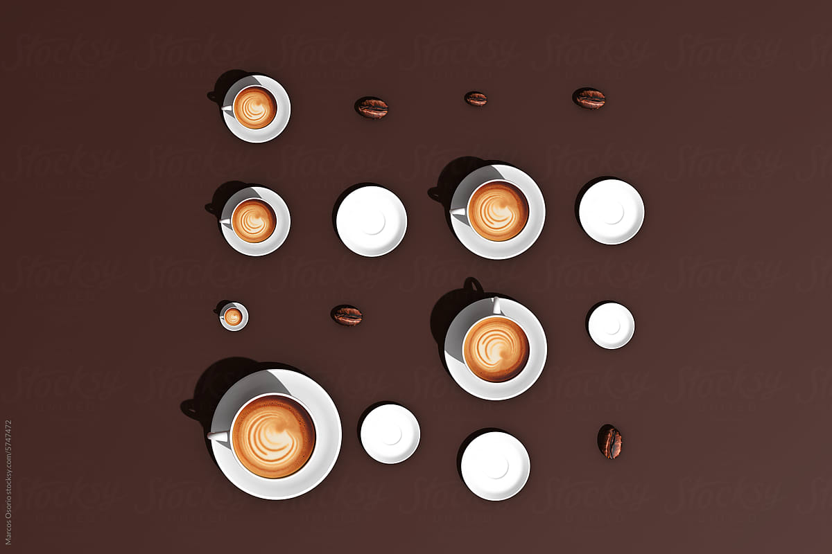 A table topped with lots of coffee cups and saucers