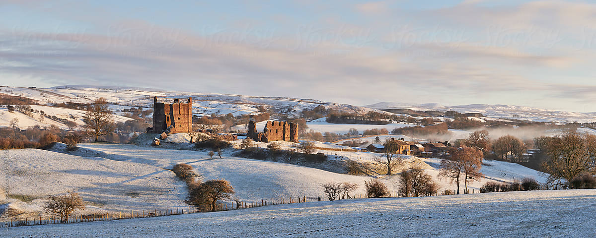 Brough Castle and snow at sunrise. Church Borugh, Cumbria, UK.