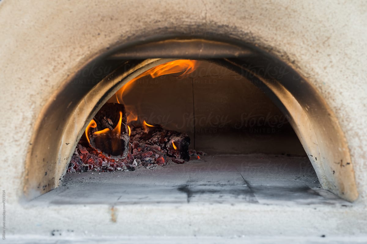 fire aflaming in an outdoor pizza oven