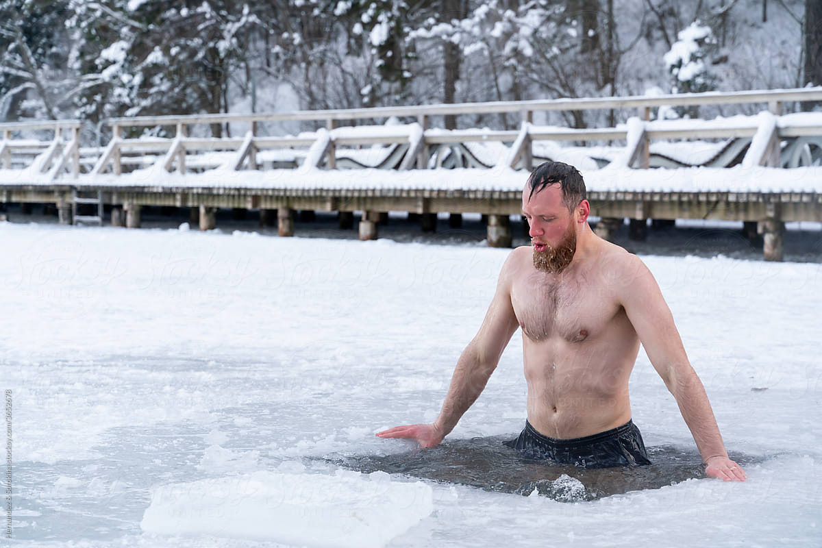 Man Staying In Ice-Hole