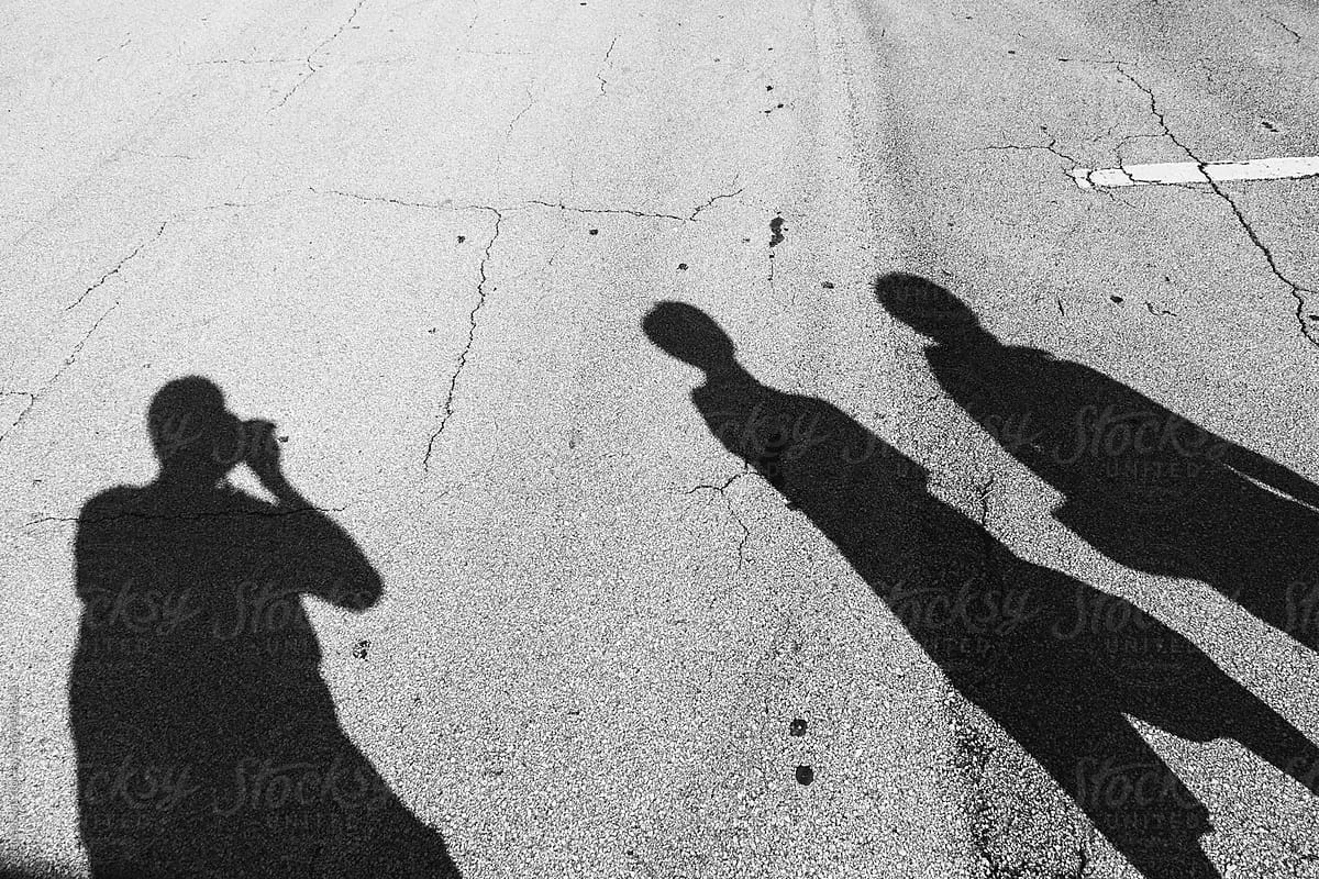 Three shadows of people
