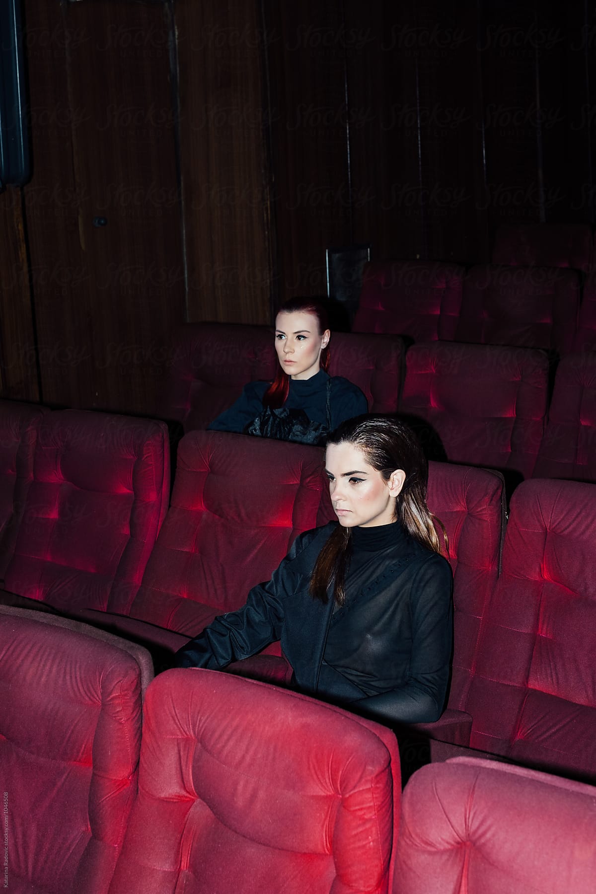 Two Female Models Sitting In A Cinema By Stocksy Contributor Katarina Radovic Stocksy