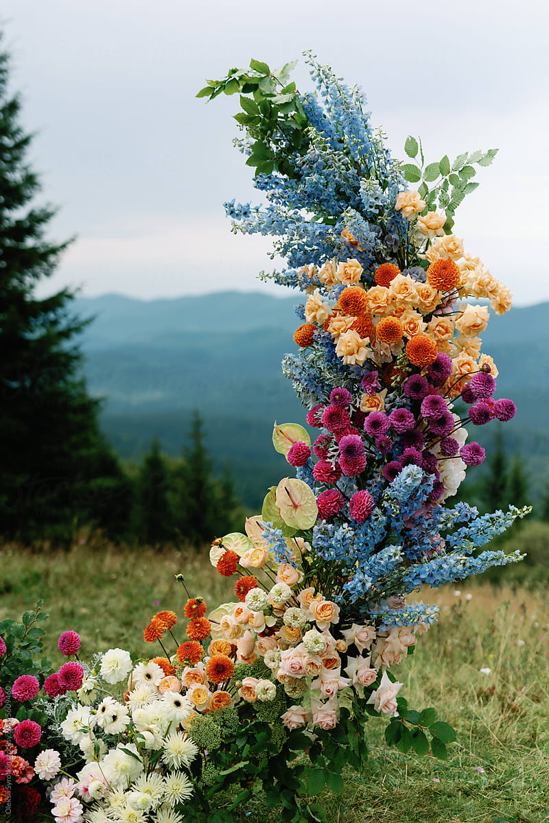 Floral blooming installation wedding ceremony alfresco mountain decor