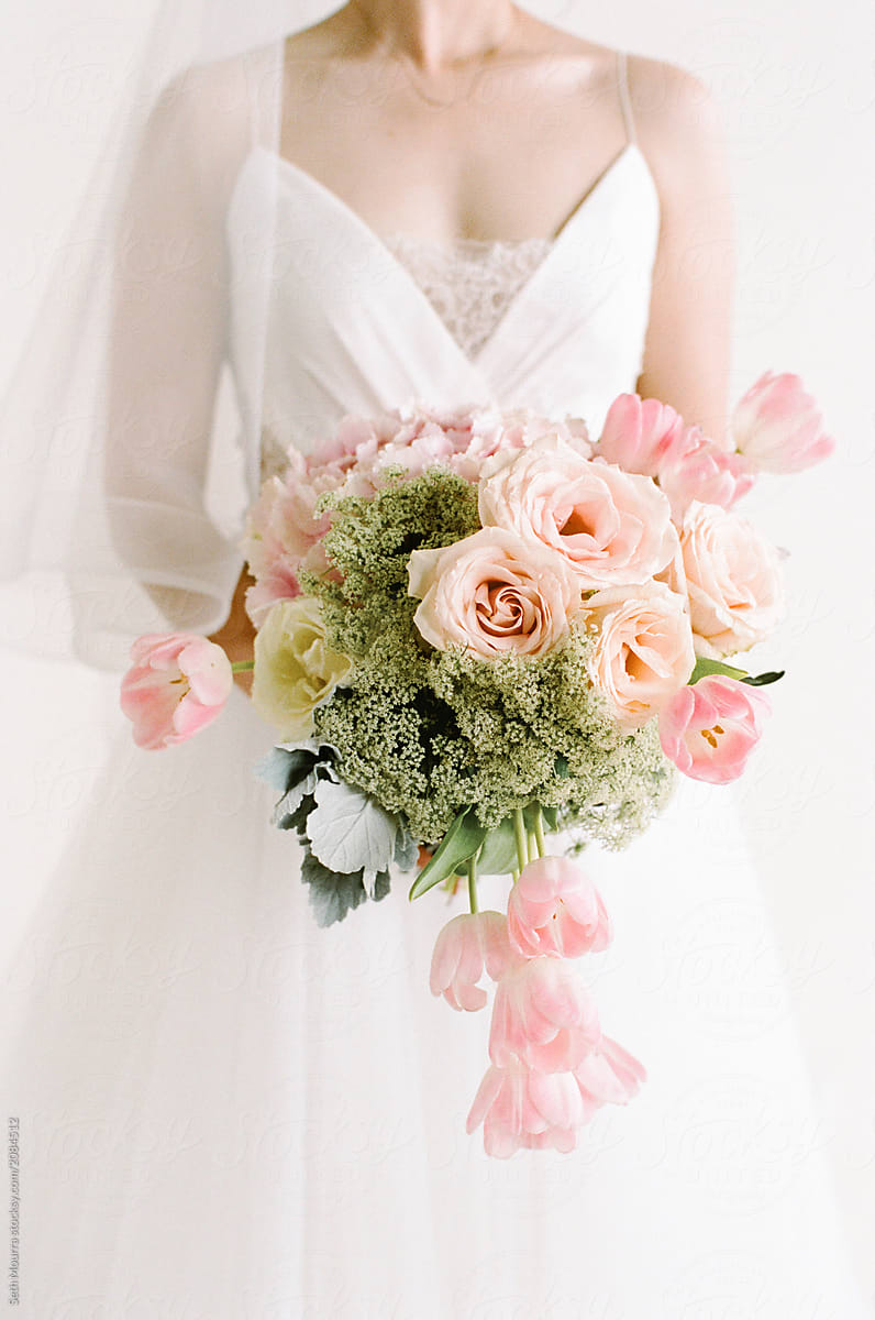Bride holding a bright pink Bouquet