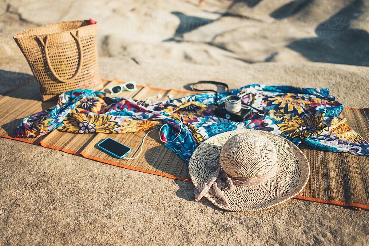 Various Objects And Phone On The Beach