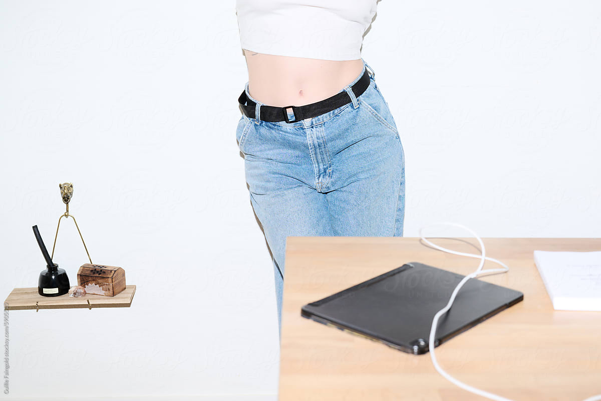 Woman in Jeans by Desk