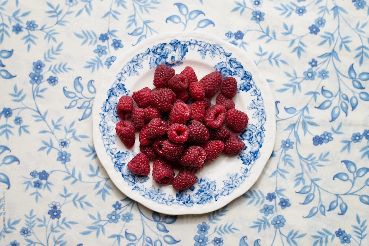 Fresh raspberries in decorated dish