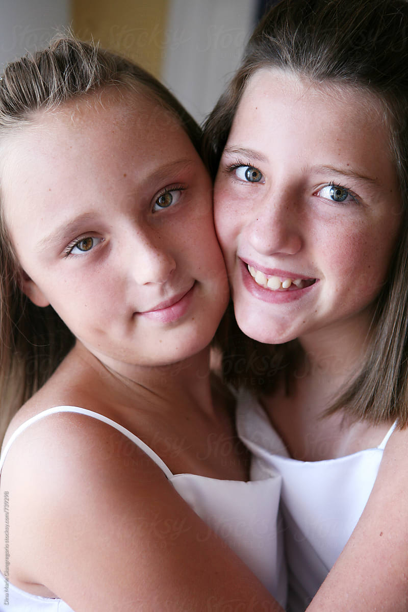 Two Young Girls Cheek To Cheek In White Dresses By Stocksy Contributor Dina Marie