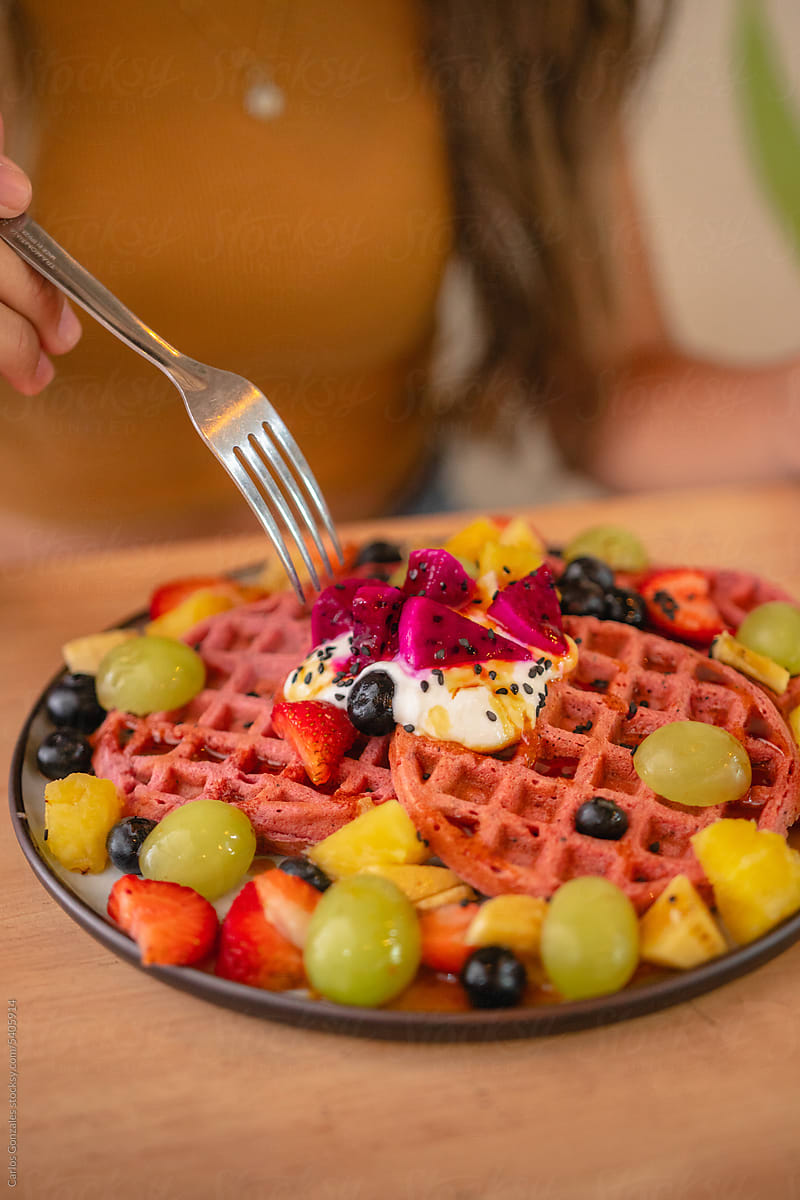 Pink waffles with fruit