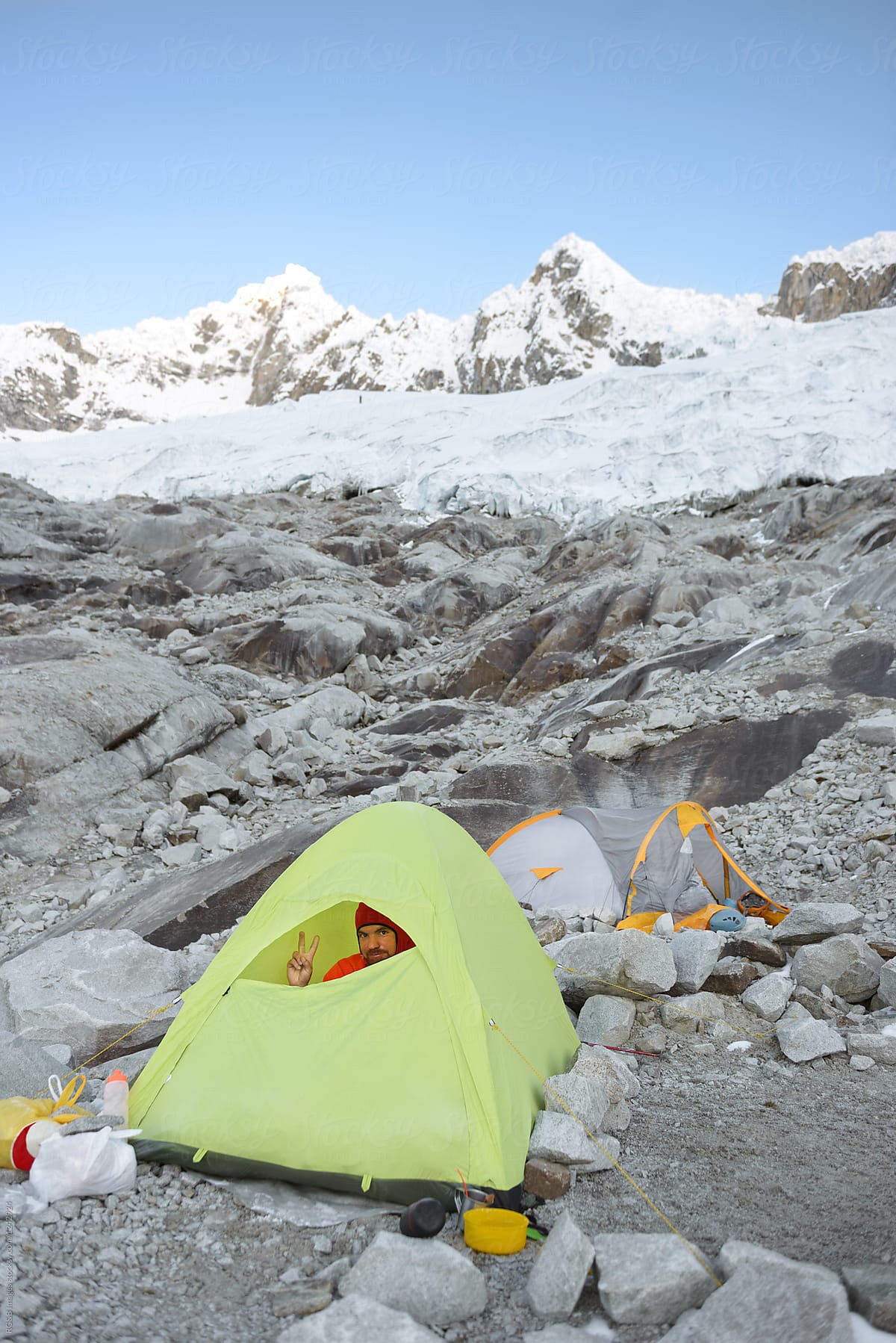 Man peeking from his tent outdoor in the basecamp