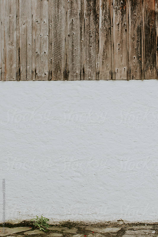 Background of wood over stone wall