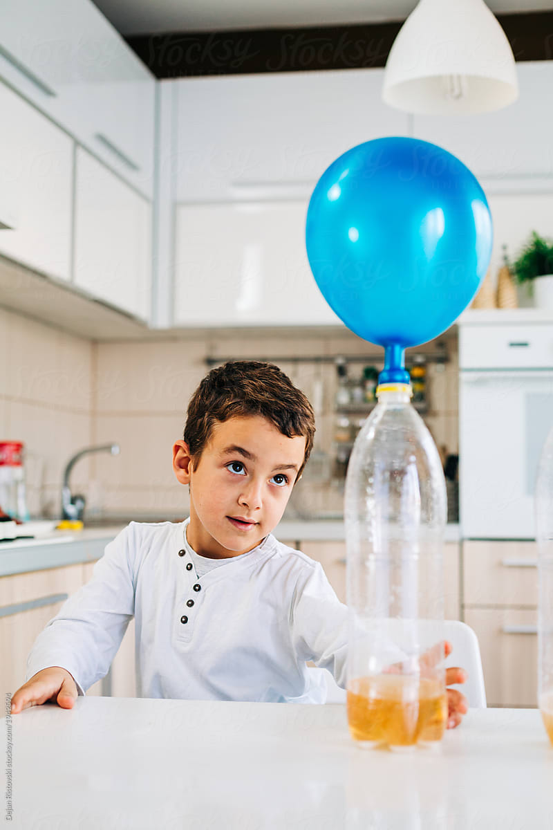 Boy making experiments and playing in the kitchen.Learning science
