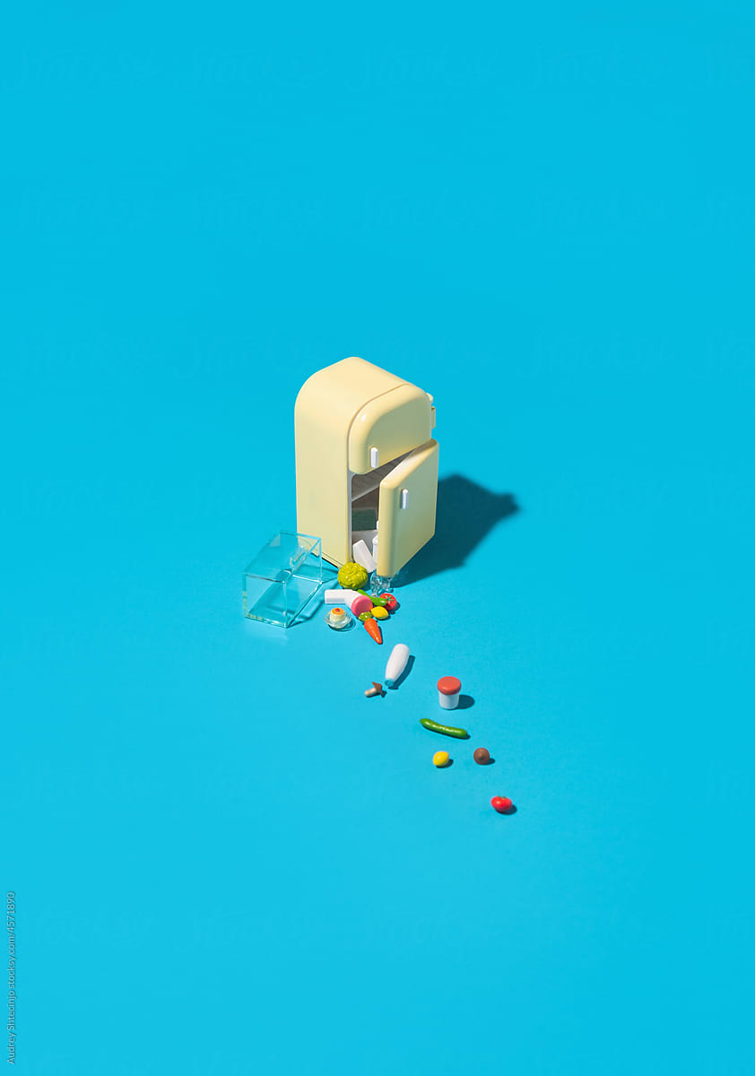 Miniature of fridge on blue background