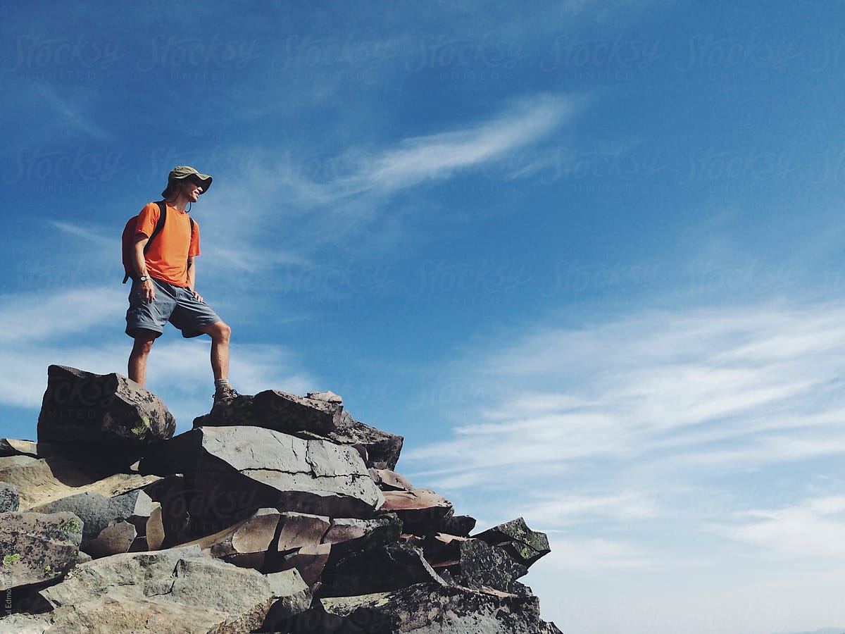 Male hiker standing on mountain summit