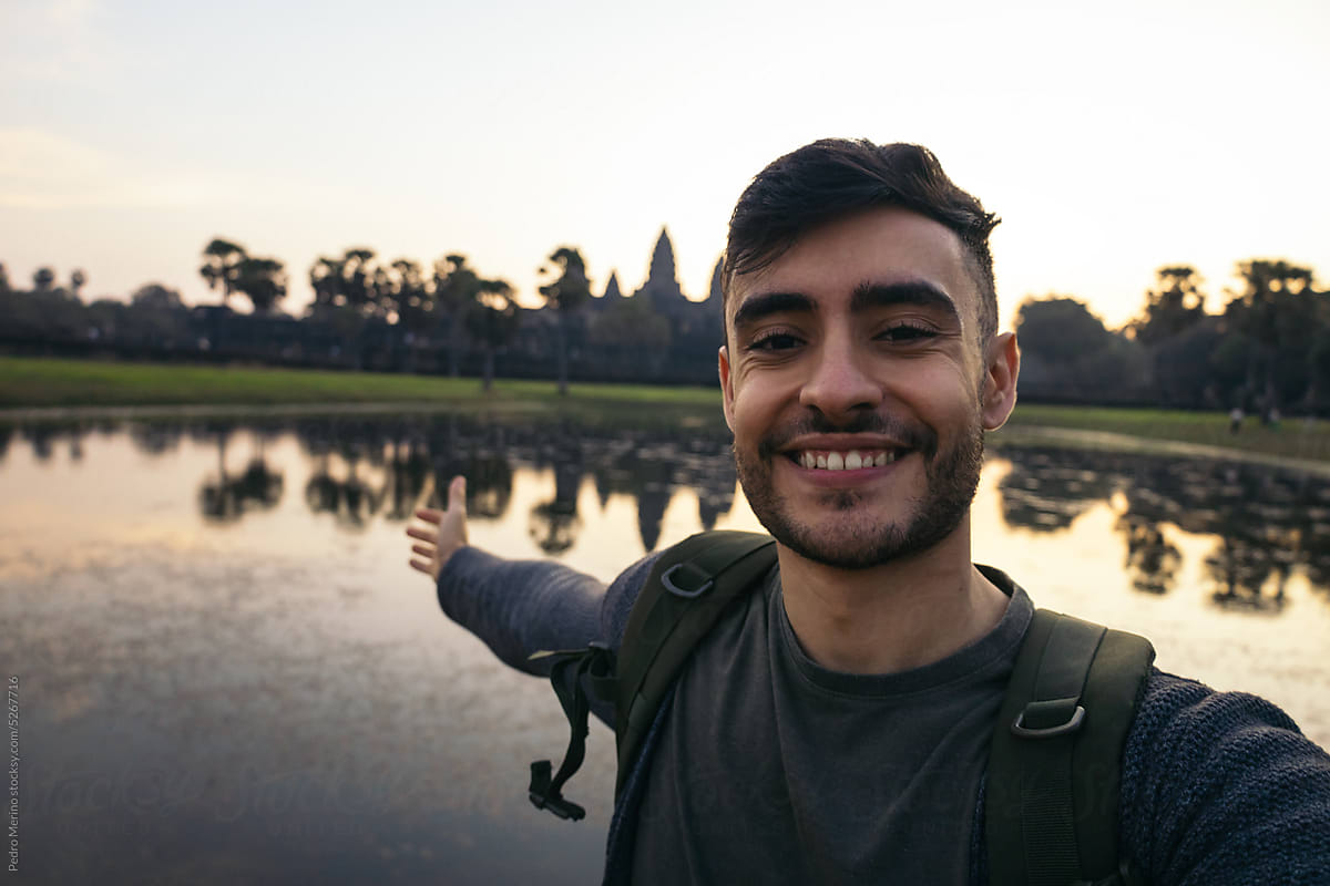 Happy traveler man in Angkor Wat