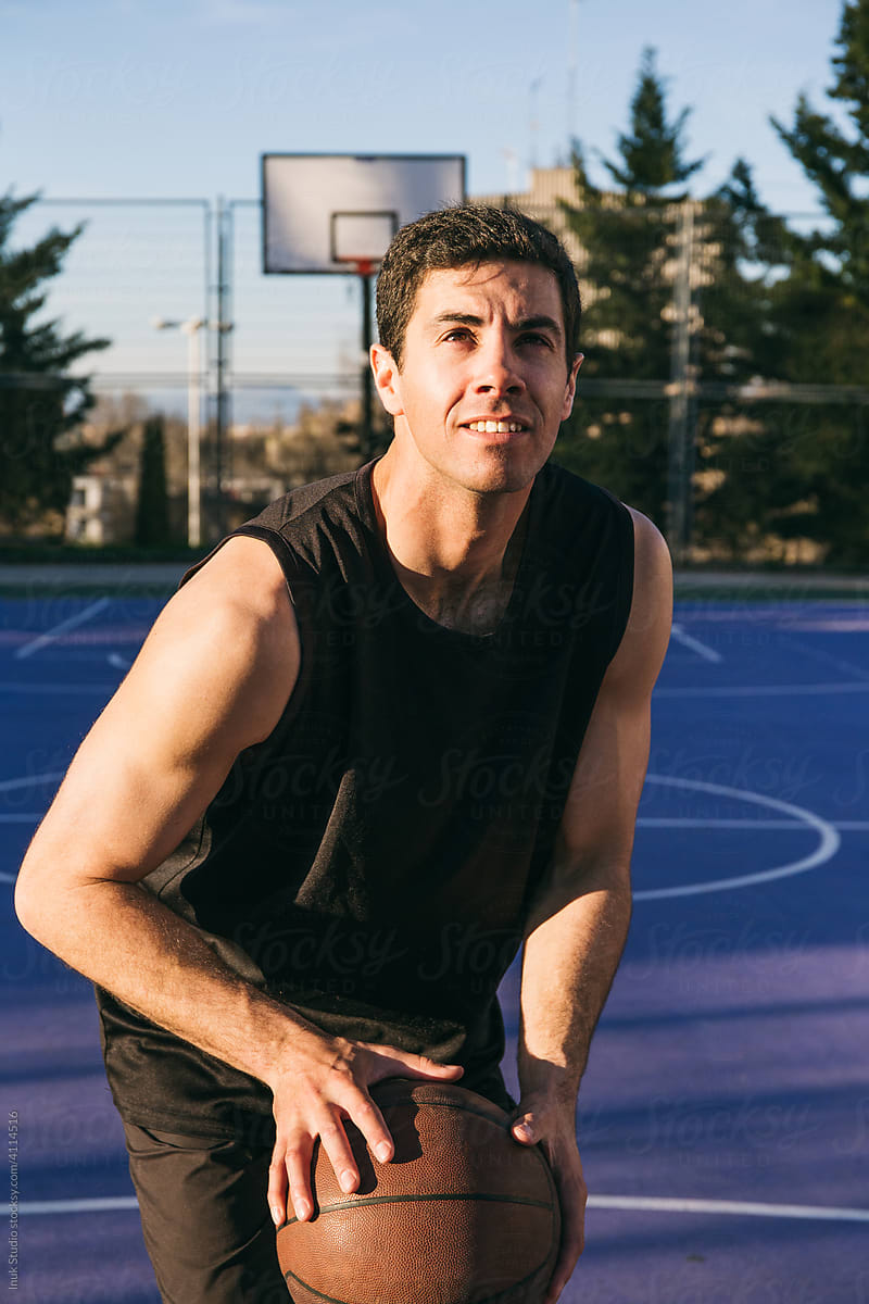 Concentrated player with basketball