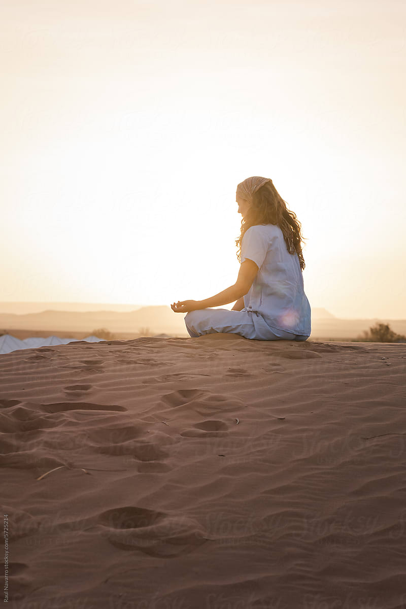 Tranquil Woman Meditating in Solitude Amidst Desert Landscape