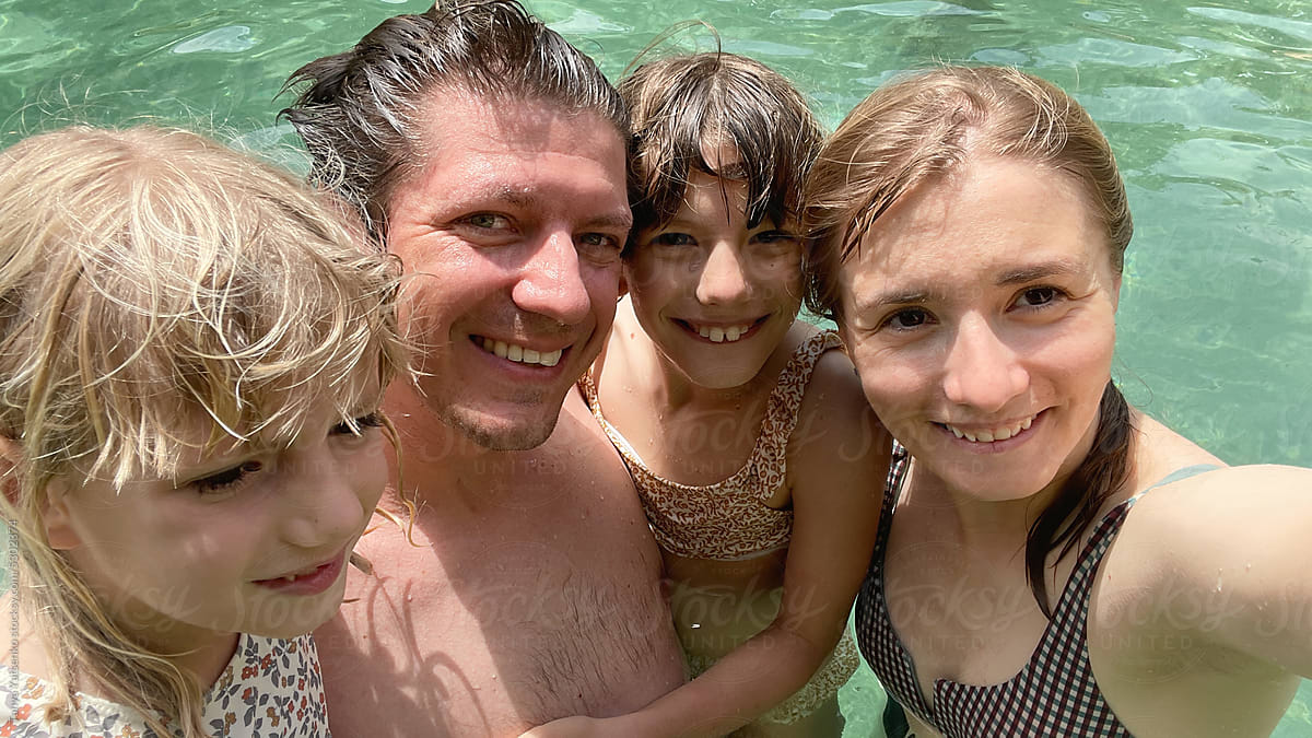 Family selfie photo in the pool